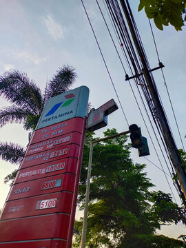 Bandung, Indonesia - 05.19.2024 : A Pertamina gas station signboard displaying the types of fuel and their prices, including Pertalite, Pertamax, Pertamax Turbo, Bio Solar, and Solar Dex.