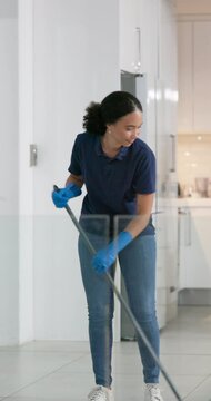 Sweeping, woman and cleaning for office, service and solution for hygiene, maintenance and broom. Person, employee and maid in workplace, neat and fresh with dust free space and spring cleaning