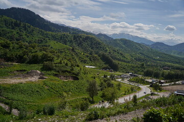 Almaty, Kazakhstan - 05.22.2024 : An asphalt road in a mountainous area.