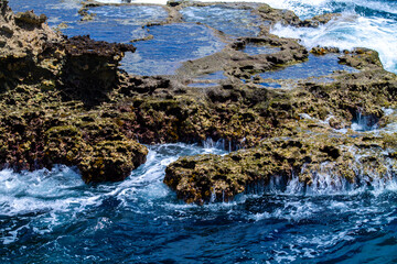 Beautiful seascape with blue sea, rocks and waves.