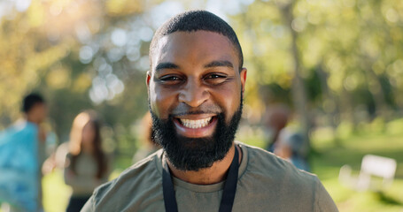 Black man, portrait and smile in park for charity, volunteer and community service work with...