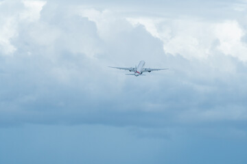 plane taking off from the runway in winter in bad weather.