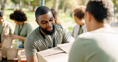 Charity, cardboard boxes and volunteer in park for donation, distribution or community service....