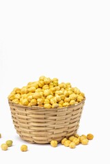Closeup of Roasted Chickpea or Garbanzo Bean in a Bamboo Basket Isolated on White Background with Copy Space, Also Known as Bengal Gram or Egyptian Pea