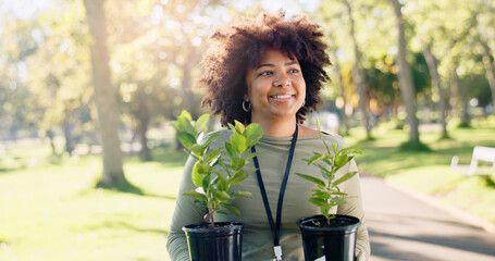 Volunteer, happy woman and plants at park for earth day, gardening or thinking of sustainability in...