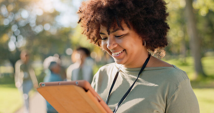 Woman, volunteer and happy nature with tablet in outdoor, community work and environment sustainability project with group. Recycle, waste management and cleaning outside trash, help and ngo support
