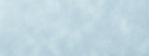 Texture of light blue craft old paper, crumpled background. Vintage sky grunge surface backdrop.