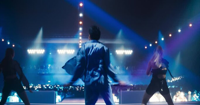 In Front of a Sea of Adoring Fans Young Pop Singer Delivers an Unforgettable Concert. Choreography on Stage, Charismatic Presence and Heartfelt Lyrics Captivate and Excite the Crowd of Music Goers