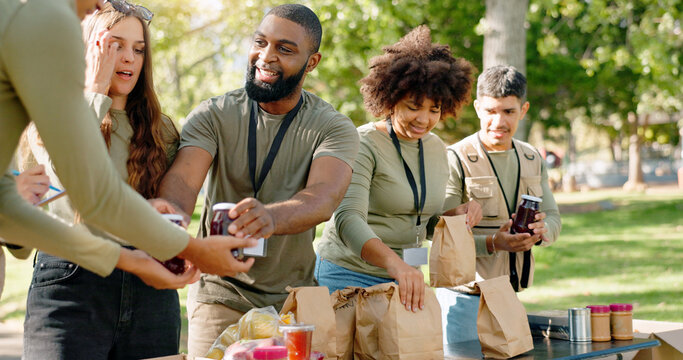 Happy people, volunteer and food with bags for charity or community service at outdoor park. Group or team working together in NGO with resources, supplies or mission for future or giving in nature