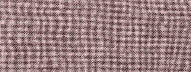 Dark brown background from textile material with wicker pattern and texture, macro.