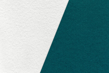 Texture of craft white and emerald paper background, half two colors, macro. Vintage kraft teal cardboard.