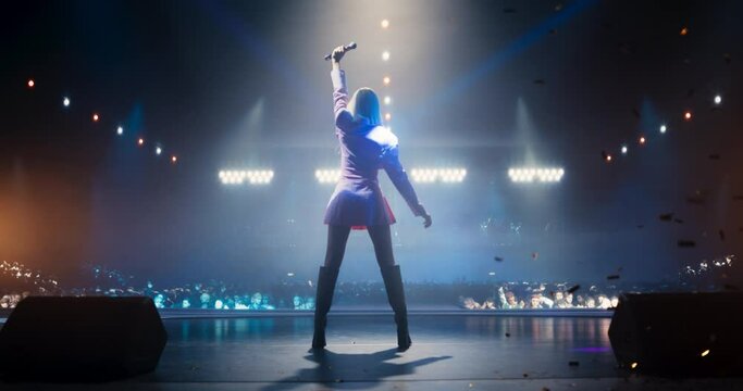 Pop Musician Coming on Stage to Give a Breathtaking Performance Under the Rain of Confetti. Stunning Choreography and Beautiful Visual Effects Enhance the Emotional Connection With the Audience