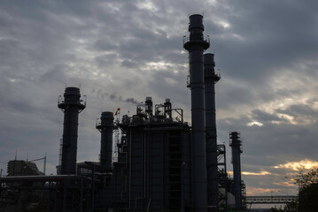 Gas turbine electrical power plant at dusk - factory - petrochemical plant