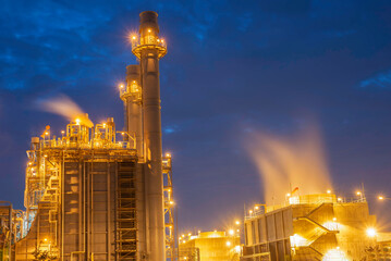 Gas turbine electrical power plant at dusk - factory - petrochemical plant