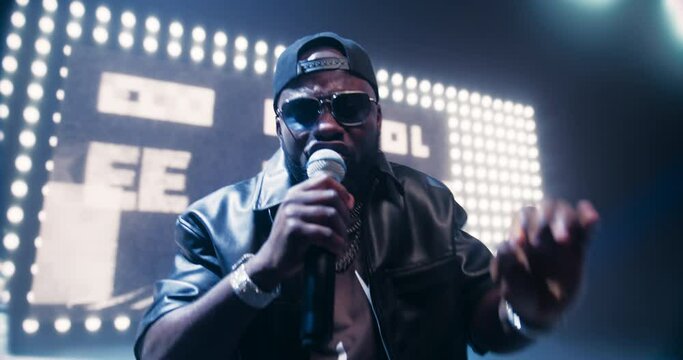 African American RnB Artist Delivering a Grand Performance in a Packed Concert Arena. Portrait of Singer Vibing on Stage. Young Music Fans Enjoying Nightlife Entertainment at a Concert