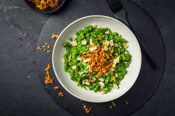 German egg noodles - Spinach spaetzle with parmesan and roasted onions