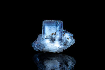 Fluorite with phantoms under Short wave ultraviolet. UV photography isolated on black background....