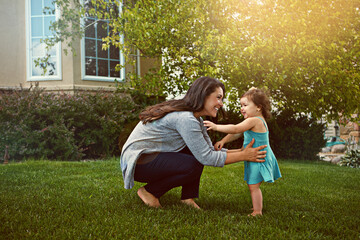 Mother, daughter and happy with playing in garden for fun activity, bonding and smile outdoor in home. Family, woman and child on grass of house with care, explore and healthy relationship in nature