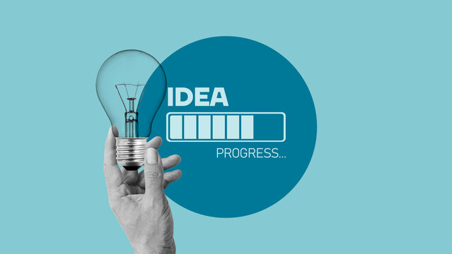 Loading idea business concept and progress. Idea loading concept with light bulb on blue background. Creativity for business idea and problem solving. Brainstorm in progress