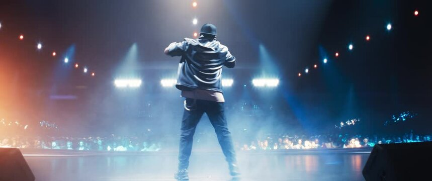 Artist Electrifies the Stage with His MCing, Captivating a Sold-Out Audience With His Performance. Stunning Visual Effects Creating an Unforgettable Night for Fans. View From Back. Anamorphic Shot