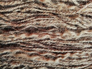 Linen yarn rope & thread texture background. Flax fibers for production of linen fabrics, linen yarn & thread pattern. Twisted raw hemp or cotton yarn, thread, rope - grunge curve material wallpaper