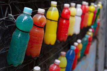 Collection of colorful plastic bottles hanging
