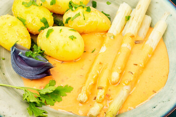 White boiled asparagus with potato