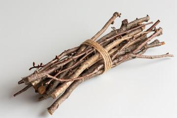 A bundle of sticks on a white surface background