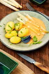 White boiled asparagus with potato