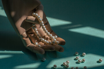hand with pearls and bracelet