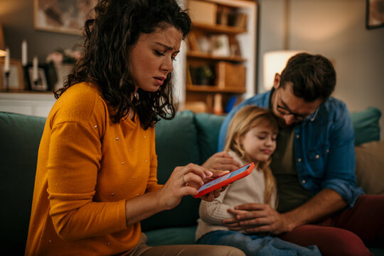 Anxious young Caucasian mom call ambulance doctor take care of sick small girl child having flu and high temperature. Worried family contact therapist