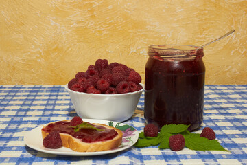 raspberry jam on the table,raspberry jam with bread for breakfast, jam dessert concept