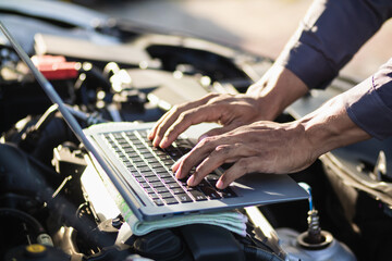 car service center mechanics are checking condition car and engine make sure they are ready use and...