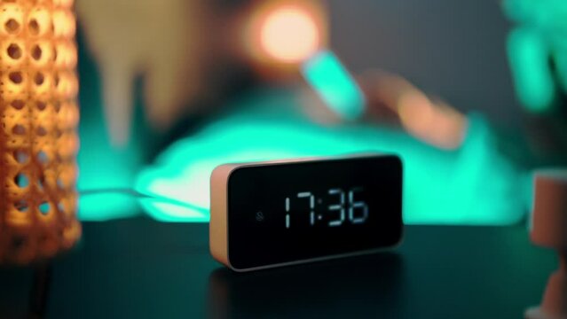 smart home alarm clock on bedside table