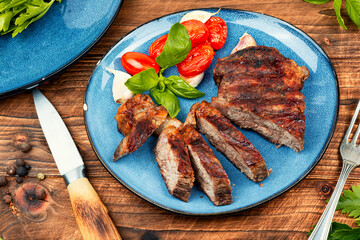 Barbecue grilled beef steak.