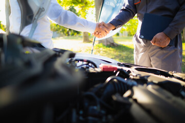 Technicians from service center inspect and assist customers cars that are having problems while traveling build confidence in customers who choose buy car from service center and receive help quickly