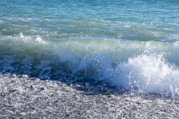 Sea wave crashing on the shore