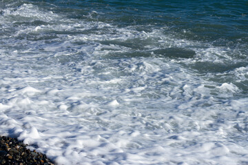 Sea wave crashing on the shore