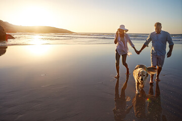 Ocean, sunset and couple with dog in nature for outdoor adventure, travel or summer holiday...