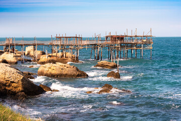 Traditional wooden fishing house with a net near sea coast