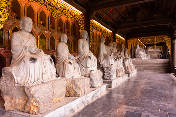 Many Buddha statues in a hindu pagoda in Vietnam