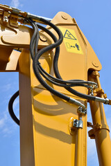 The yellow crane is a manipulator with a hydraulic cylinder. The working equipment of the...