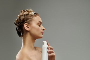 Stylish woman holding spray bottle, caring for wet hair.
