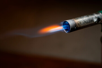 Fototapeta premium Blowtorch with blue and orange flame