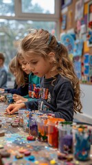 Fototapeta premium A classroom full of children making arts and crafts together. 