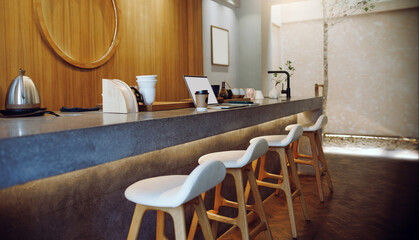 Comfortable workplace on counter bar and seat in cafe with computer laptop, mobile put on note book, coffee cup and coffee making equipment in background, taking a break after work concept