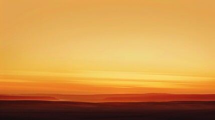 Fototapeta premium Subtle gradients fade into the distance, like the colors of a sunset melting into the twilight, painting the sky with hues of orange and goldbackground