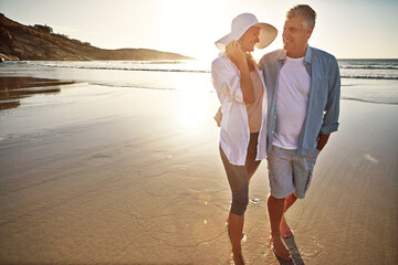 Happy couple, walk and beach with hug on holiday, island or coast for getaway, travel or vacation...