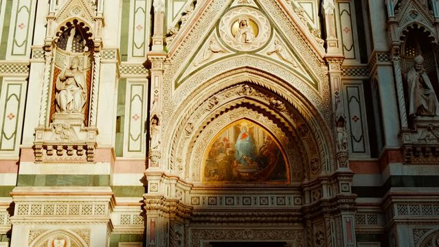 Close-up view of Florence Cathedral, Cattedrale di Santa Maria del Fiore or Duomo di Firenze, with intricate marble patterns and Renaissance details, Tuscany, Italy