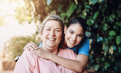Healthcare, happy and senior woman hugging nurse in portrait at retirement home for assisted living. Mature, female person and smile with embrace for caregiver in garden for rehab, support and care